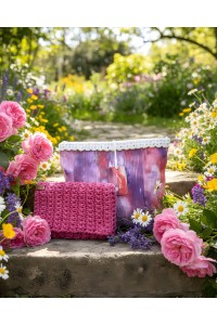Grace Note Paionia handmade crochet wallet displayed in a blooming garden