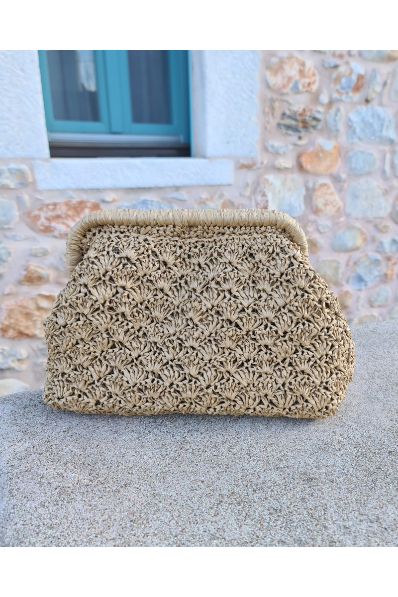 Close-up of a clutch bag with a boho chic aesthetic