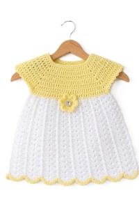 Handmade crocheted baby items set in yellow color