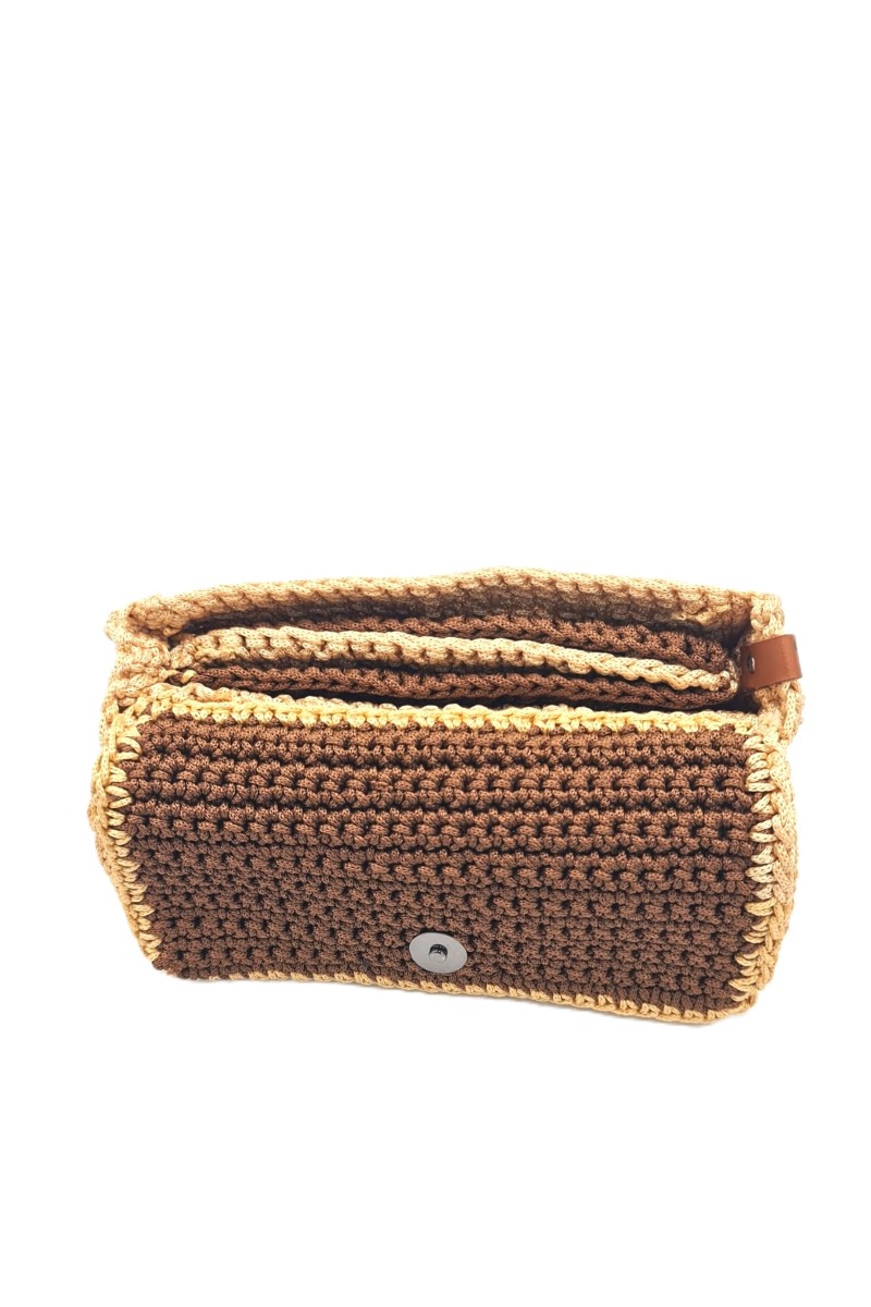 Close-up of handmade Sempreviva crochet wallet