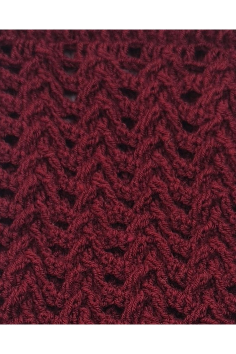 Close-up detail of handmade burgundy crochet neck warmer