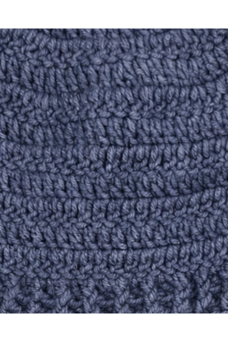 Close-up of handmade crochet texture on a blue beanie hat