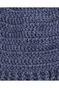 Close-up of handmade crochet texture on a blue beanie hat