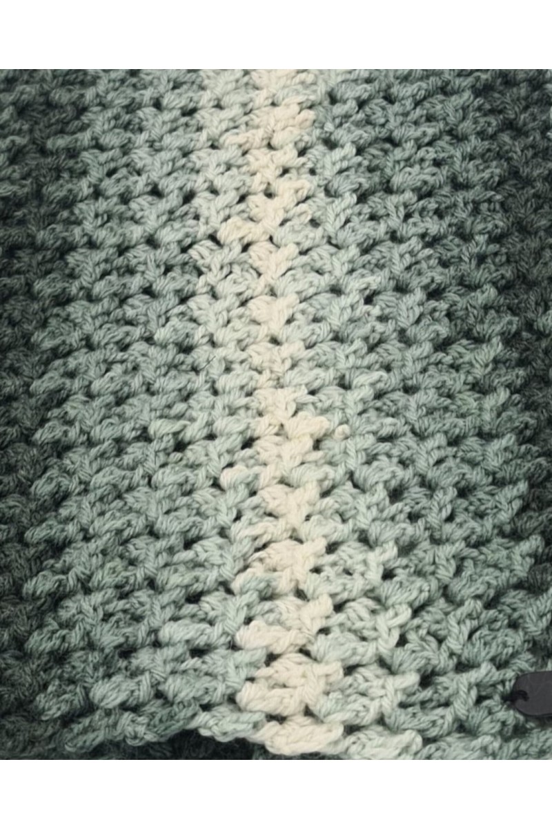Close-up detail of handmade crochet neck warmer stitch pattern in sage green and cream shades