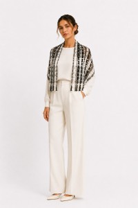 Elegant handmade black and white crochet scarf by Grace Note styled in a refined editorial fashion look.