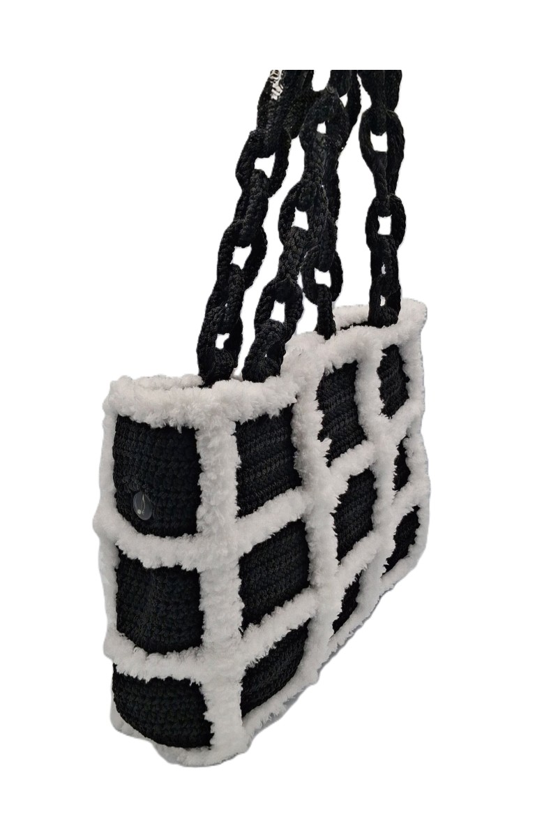 Side view of the Artemis black and white handmade crochet tote bag by Grace Note.