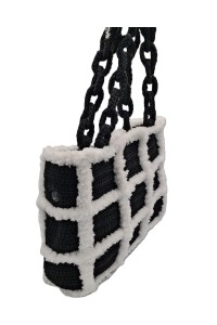 Side view of the Artemis black and white handmade crochet tote bag by Grace Note.