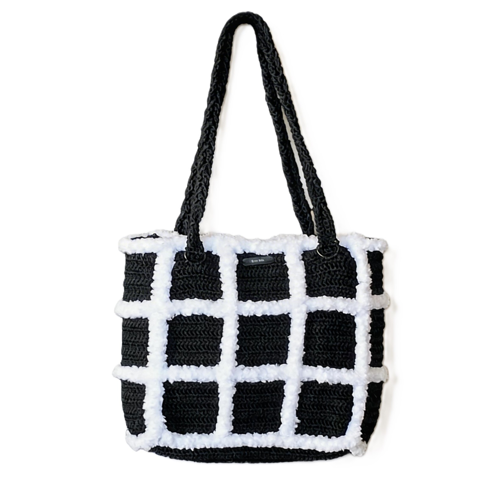 Front view of the Artemis black and white handmade crochet tote bag by Grace Note.