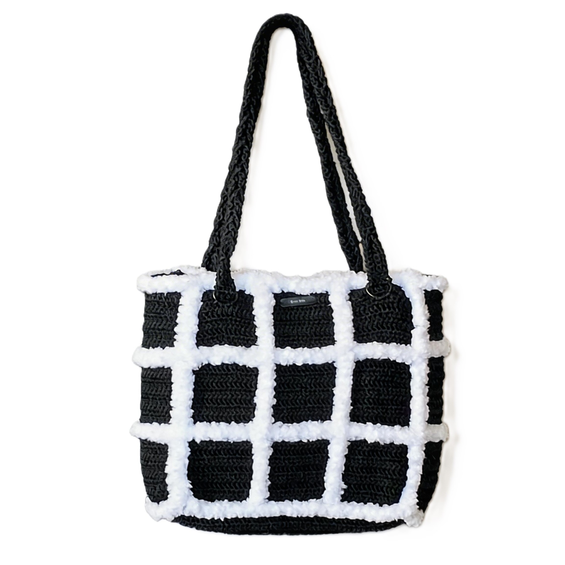 Front view of the Artemis black and white handmade crochet tote bag by Grace Note.