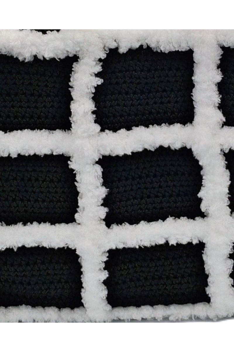 Close-up of the handcrafted crochet texture of the Artemis black and white tote bag by Grace Note.