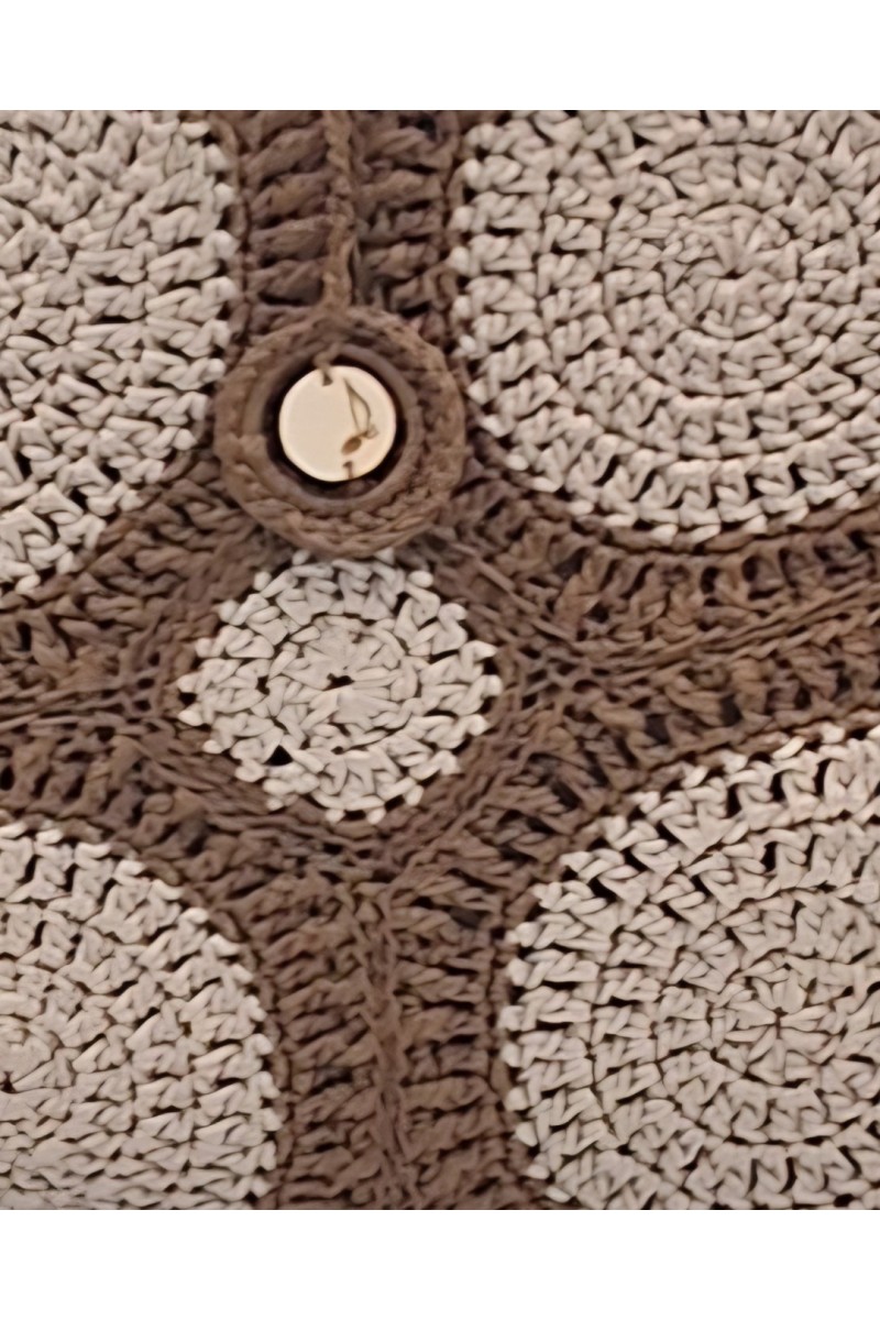 Close-up of the crochet texture and button detail of the Melia tote bag by Grace Note.