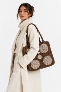 The Melia handmade crochet tote bag by Grace Note styled with an elegant winter outfit in natural tones