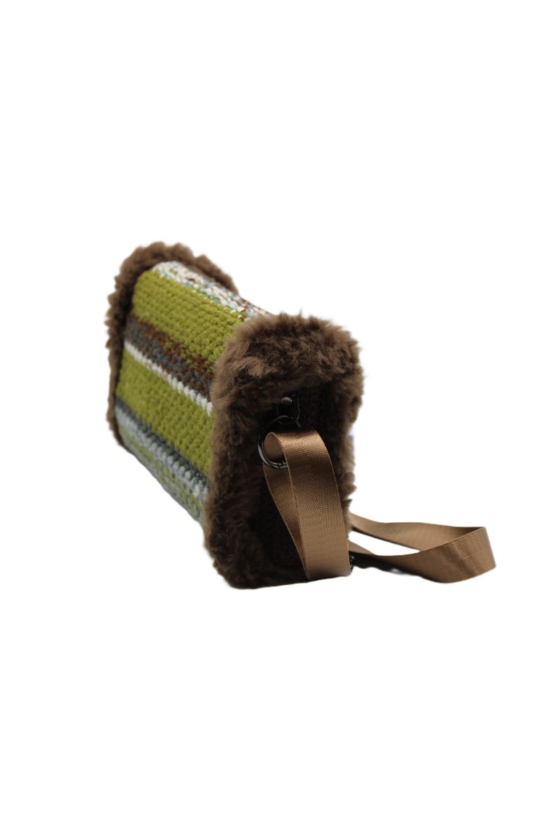 Side view of the Grace Note Thoosa Handmade Art Bag with faux fur details and an adjustable shoulder strap.