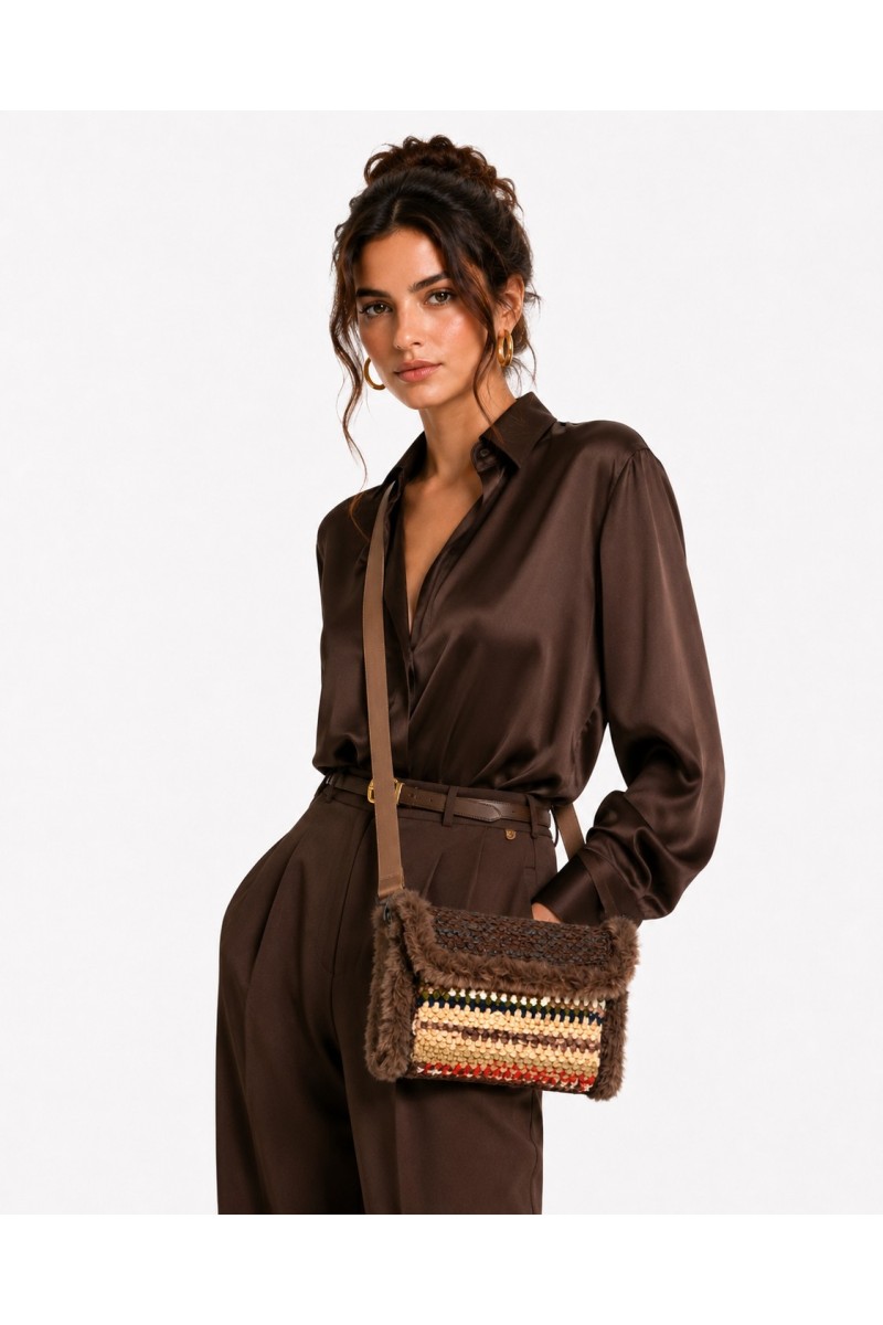 Grace Note Thoosa Handmade Art Bag worn by a model, handcrafted in Greece