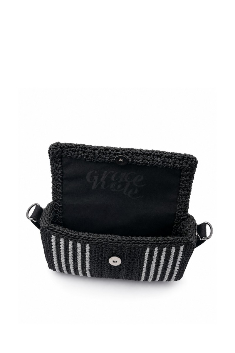 Interior of the Asterodia Handmade Art Bag by Grace Note with fabric lining and magnetic closure.