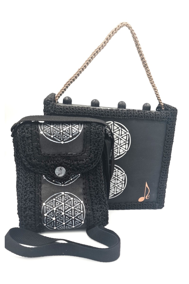 Erytheia hand-painted one of a kind art bag with white circular motifs on dark canvas