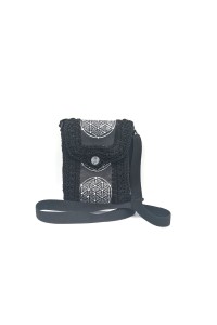 Front view of Erytheia one of a kind hand-painted bag with circular artwork
