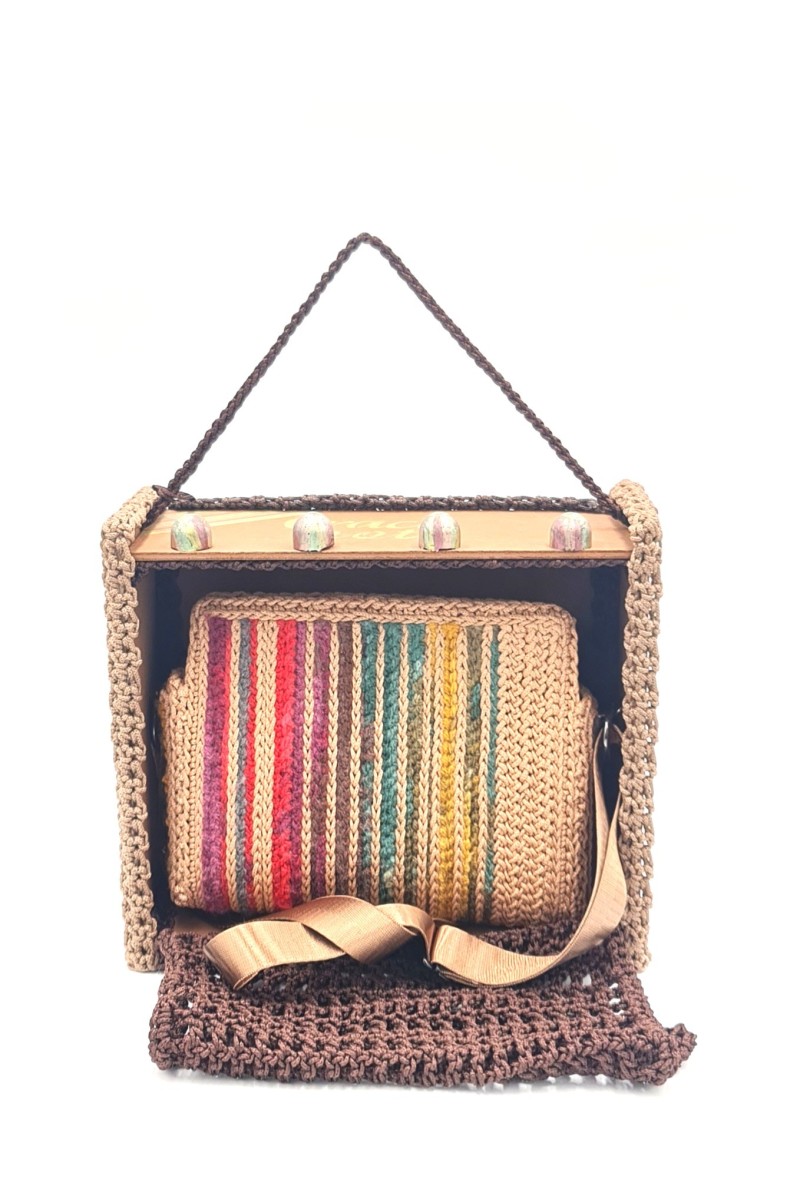 Close-up of Endiida bag in its handmade wooden packaging box