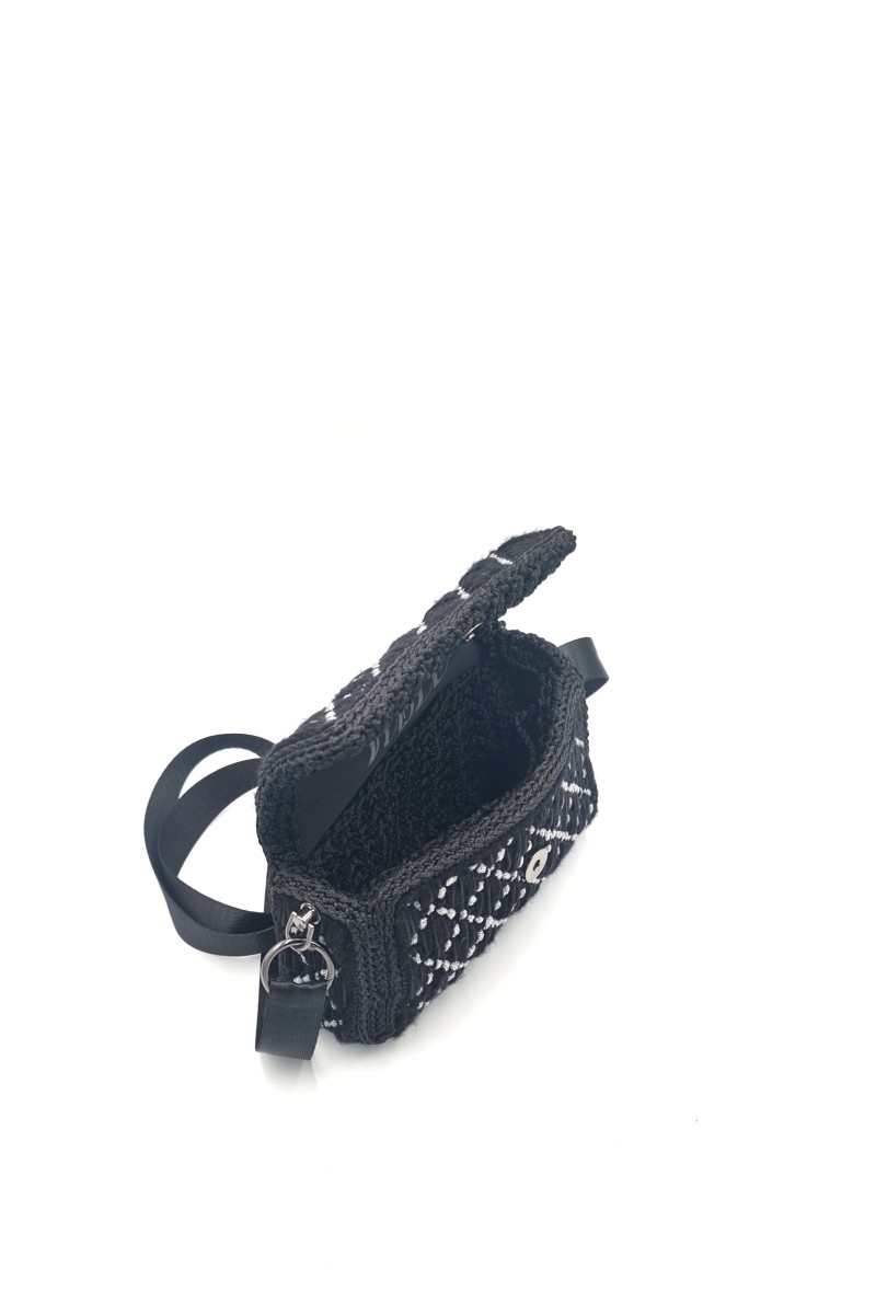 Side view of Ava one of a kind embroidered bag with geometric texture