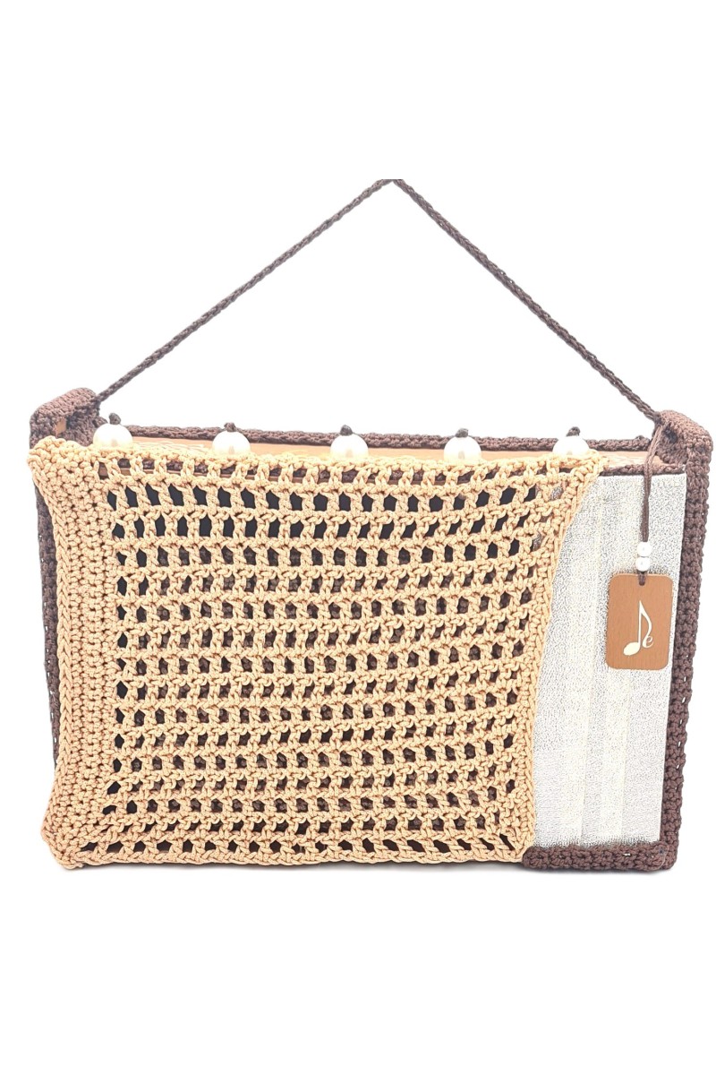 Detail of handcrafted textile texture in earthy tones on Volina one of a kind art bag
