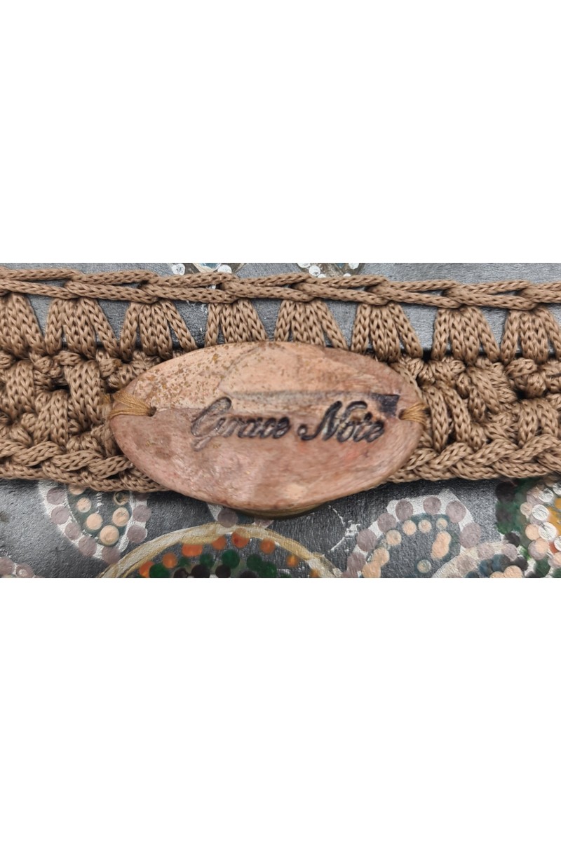 Handcrafted decorative clasp on Achinoe Handmade Art Wallet