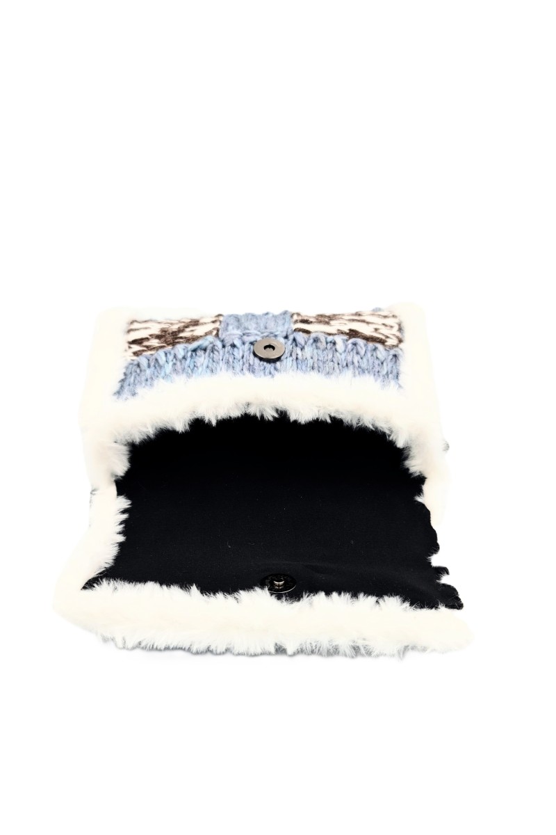 Close-up of handmade embroidery details on Imalia handmade art bag